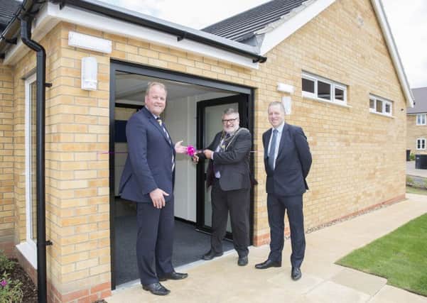 Mayor Dave Hodgson cuts the ribbon to officially open Aspires new sports pavilion with Orbits divisional managing director, Andrew McDermott, left, and executive director of property investment, Paul High right.