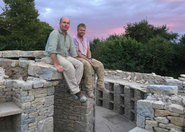 Managing director Toby Angel with Martin Fildes, a build director for the monument pictured