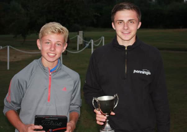 Sean Foster (left) and Conner Penning with the Beadlow Club Championship trophy. PNL-160824-110045002