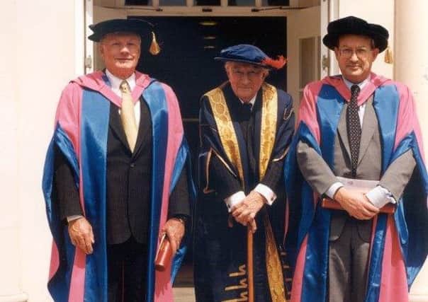 Neil Armstrong (left) accepting his honorary degree